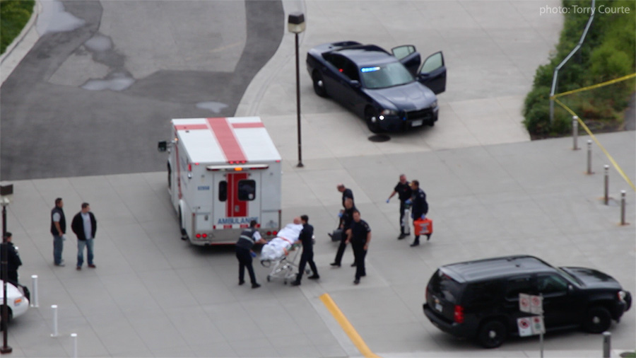 Man being treated by emergency workers.